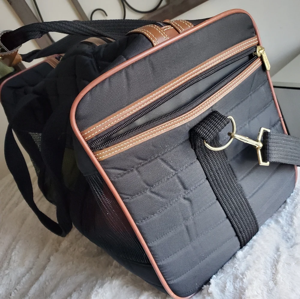 SHERPA'S mid size pet carrier with handles and shoulder strap.